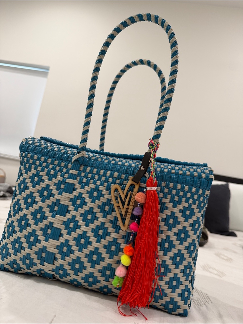 Maria Victoria Teal and Cream Woven Tote with Colorful Tassel Charm